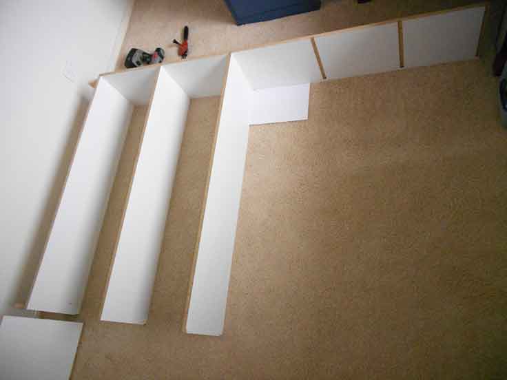 I built the bookshelf face down in the same room. Build the shelf face down.